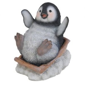 Playful Sledging Penguin Christmas Ornament